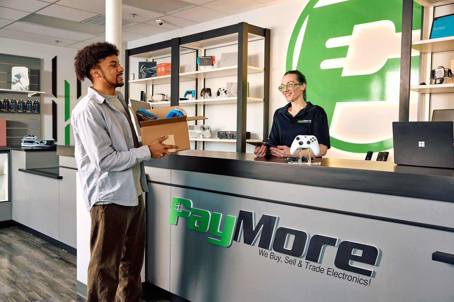 man with a box of electronics